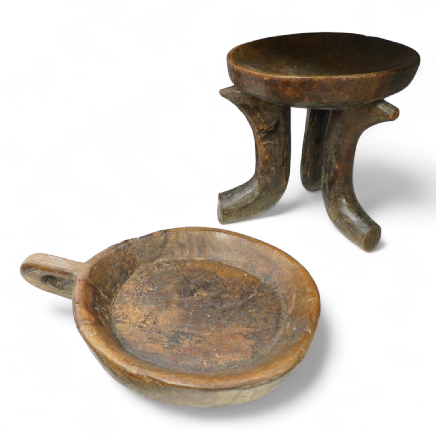 An Ethiopian tribal three footed stool and a carved handled bowl, stool 33cm high